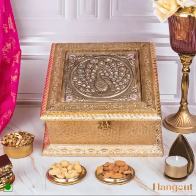 This is my signature sugar-free and gluten-free festive hamper. It brings together wholesome treats like granola, roasted nuts, and guilt-free bliss bars in an ornate peacock-themed box, making it perfect for health-conscious gifting.