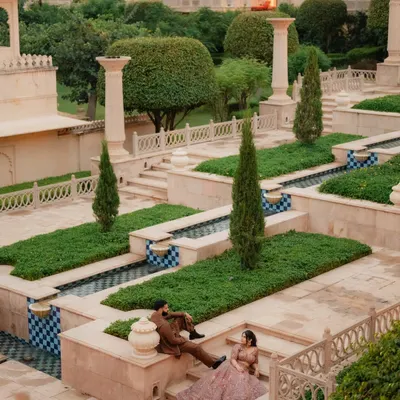 A grand portrait of Radhika and Dhyeya amidst the stunning architecture of The Oberoi Udaivilas. This pre-wedding shoot in Udaipur was about capturing their regal elegance in a timeless setting.