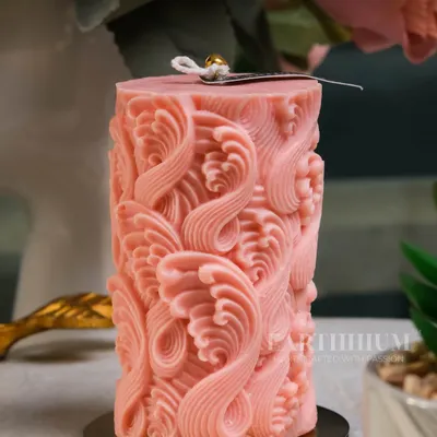This intricately carved pink pillar candle is one of my most detailed designs. The wave-like pattern creates a beautiful play of light and shadow, making it a true statement piece.
