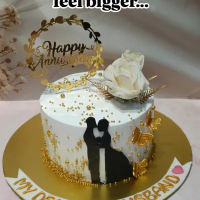 A beautiful anniversary cake for "My Dearest Husband." The design features a silhouette of a couple, golden butterflies, and a "Happy Anniversary" topper.