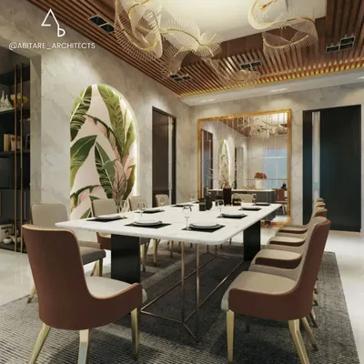 This formal dining space is defined by its luxurious details. A slatted wood ceiling adds warmth, while custom leaf-like chandeliers create a dramatic focal point above the marble dining table, perfect for hosting memorable dinners.
