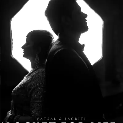 A powerful black and white silhouette of a couple, with the words "Locket for Life". The dramatic backlighting and strong composition create a timeless and artistic statement.