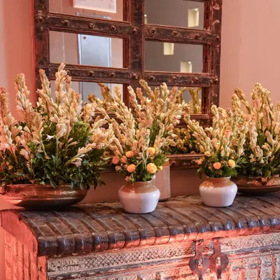The timeless elegance of Rajnigandha (tuberose). We used these fragrant flowers in traditional brass and ceramic vases to create a beautiful and aromatic welcome for a puja ceremony.