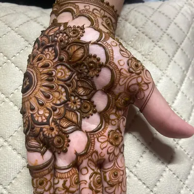 A close-up of a beautiful mandala design on the palm. This is a great option for a simple yet traditional look.
