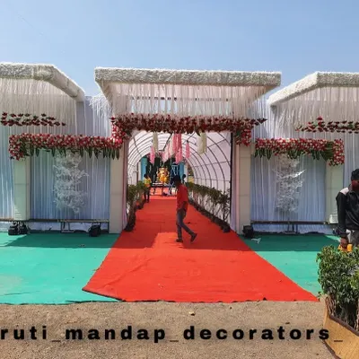This is a grand entrance structure I built for an outdoor wedding. It creates a formal entry point and looks great in photos. The red carpet leads guests through a decorated tunnel into the main event area.