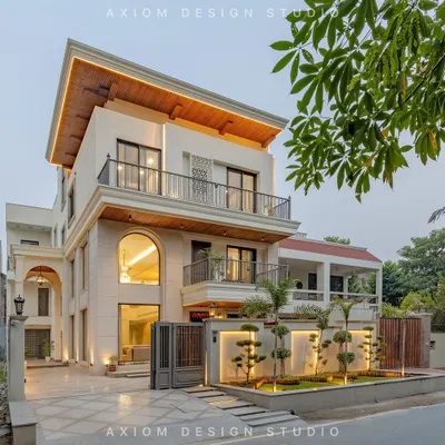 The transformation of this 20-year-old house into a modern neoclassical residence involved a complete structural and aesthetic overhaul. The new facade features grand arches, a balanced composition, and integrated lighting to create a timeless presence.