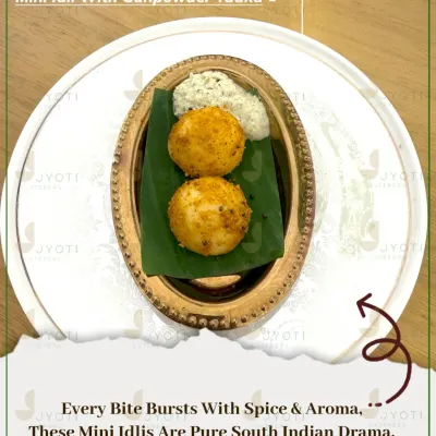 A South Indian classic with a gourmet twist. These Mini Idlis are tossed in a flavorful gunpowder tadka and served with coconut chutney for a perfect bite-sized snack.