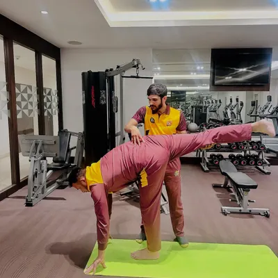 Working with cricketer Ishwar Pandey on a balancing pose to improve stability and focus. Yoga is a powerful tool for athletes to enhance their game.