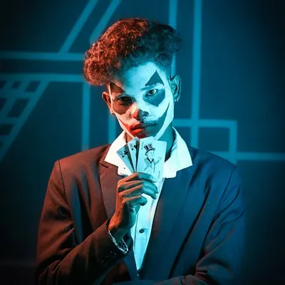 A full-concept Joker portrait. I used specific lighting to highlight the professional face paint and the playing cards, creating a shot that is both menacing and captivating, perfect for a character portfolio.