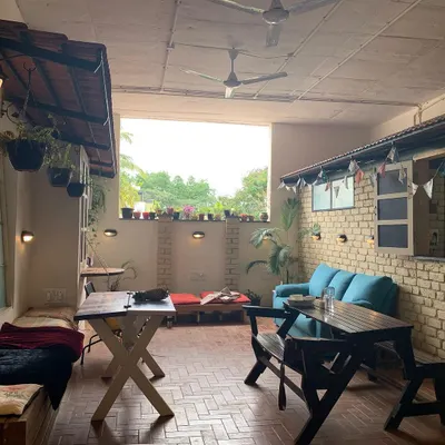 Welcome to our space. This is our cafe and lounge area, a place to relax, connect, and create before or after class. We made this space with love.