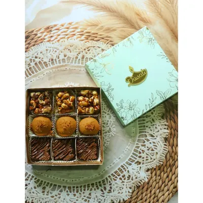 A top-down view of my "Flavours of Diwali" box, featuring a mix of fusion sweets and classic brownies. The elegant packaging makes it a perfect gift for the festive season.