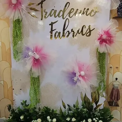 For the Trade Uno fabric store, I created this beautiful and dreamy backdrop using large, handmade organza flowers. Paired with the store's gold foil branding, this installation provided a soft and elegant photo point for customers.