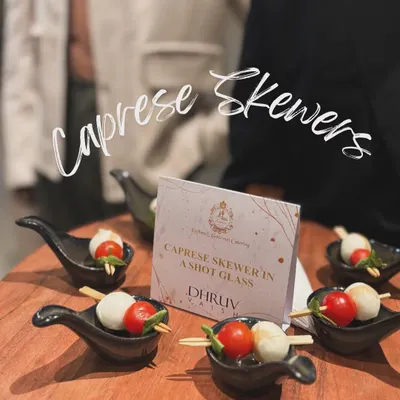 A timeless classic, my Caprese Skewers feature fresh cherry tomatoes, soft mozzarella balls, and basil, served in individual shot glasses for a modern and clean presentation.
