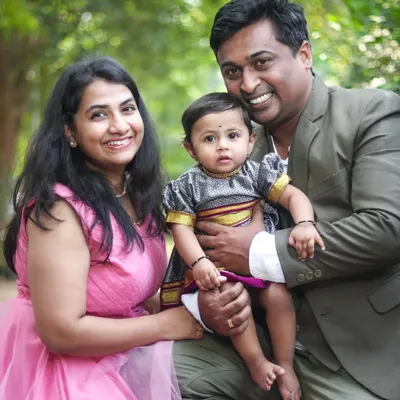A classic family portrait taken in a lovely green park. My goal is to make everyone feel comfortable, resulting in natural smiles and a photo you'll cherish for years.