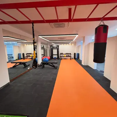A view of our spacious and well-equipped Noida facility. The setup includes a running track, a punching bag, and various strength training tools to accommodate diverse rehabilitation needs.