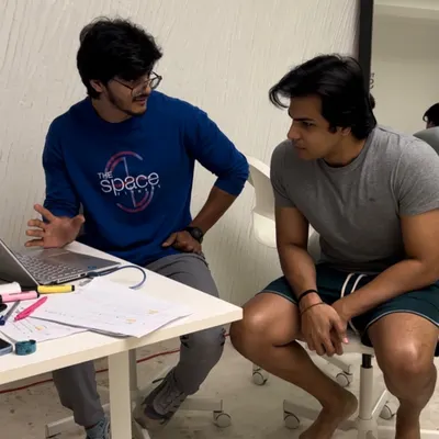 The process starts with a conversation. Here, I'm sitting down with a client during our Summer Shred program to go over his InBody results and fine-tune his plan. We believe in a data-driven, personalized approach.