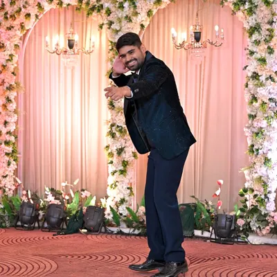 The groom striking a pose during his solo performance. I work with grooms to build their confidence and bring out their inner superstar on the dance floor.