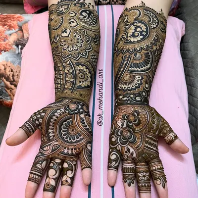 A complete bridal look with intricate patterns covering the full length of the arms. I've used a mix of bold floral work and delicate, detailed fillers to create a rich and luxurious design.