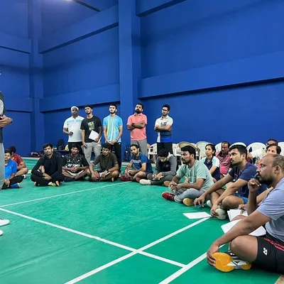 A group of aspiring coaches gathered on the court for a theory session. I believe in blending classroom knowledge with practical experience, ensuring every concept is understood in the context of real-world coaching.