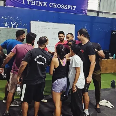 A team huddle during a CrossFit Level 2 certification seminar hosted at our facility. We love bringing the broader community together to learn and grow.
