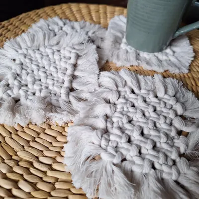 A set of my woven macrame coasters, perfect for a modern, minimalist look. They have a lovely texture and a simple fringe.