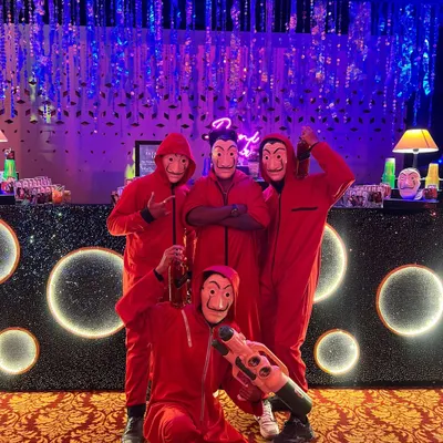 Bella Ciao! Our team is ready for the heist, fully decked out in red jumpsuits and masks. We don't just serve drinks; we become part of the themed experience for your guests.