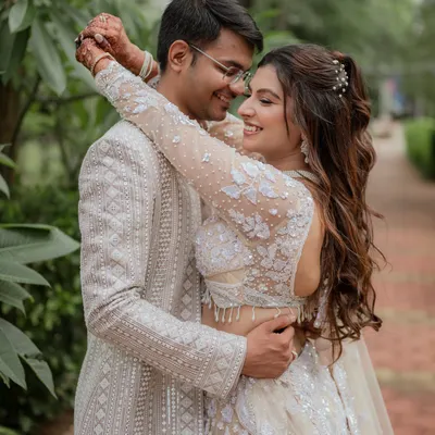 This is what pure happiness looks like. We specialize in creating a comfortable atmosphere where you can be yourselves, resulting in genuine, candid couple portraits like this intimate embrace, set against a lush, natural backdrop.