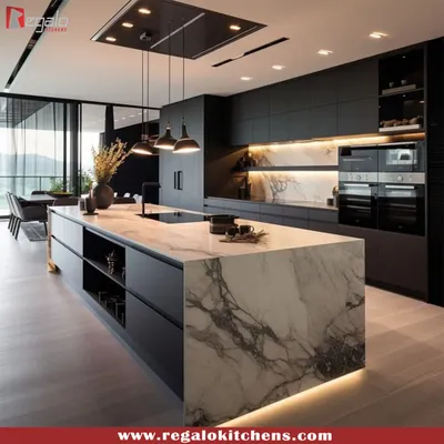 A masterclass in contrast and texture. This kitchen features a bold, black design with a striking marble waterfall island, creating a dramatic focal point. We integrated high-end appliances and minimalist cabinetry to maintain a sleek, uncluttered look perfect for modern luxury homes.