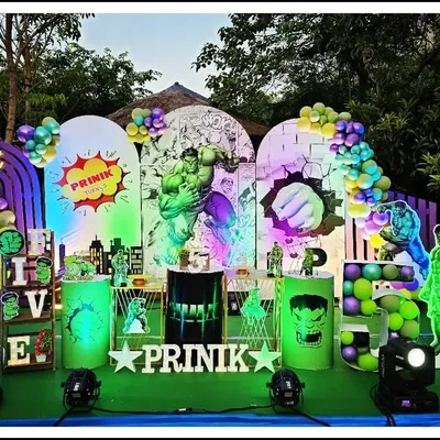 Hulk smash! This incredible Hulk-themed party for Prinik's 5th birthday is one of my most elaborate setups. It features dynamic lighting, multiple backdrops with comic book art, and several Hulk cutouts to create a truly powerful and immersive experience.