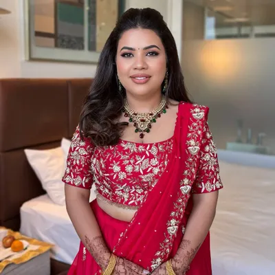 Pallavi looking absolutely stunning in red. A classic look with soft, defined eyes and a matching lip.