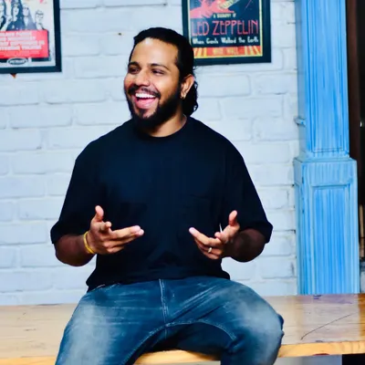 A candid moment of me enjoying the vibe at an event. I believe in being part of the energy, not just creating it.