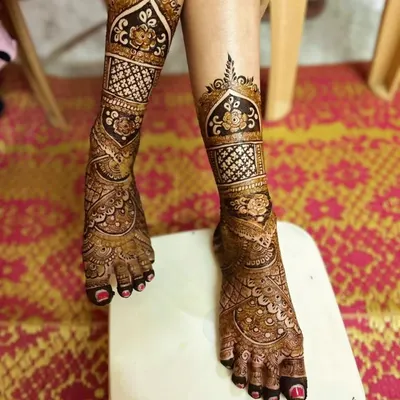 Don't forget the feet! I design stunning bridal foot mehndi that complements your hand designs. This full-coverage leg design features traditional motifs perfect for a bride.