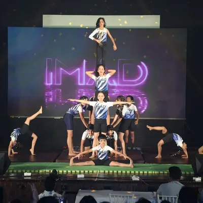 Our gymnastics routines are designed to impress. Students perform a multi-level pyramid, demonstrating balance, coordination, and the strength they've built throughout their training.