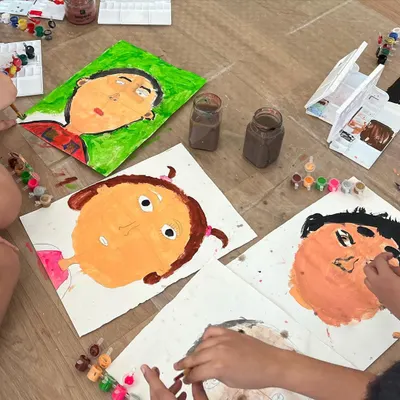 A collection of self-portraits in progress. This activity is a powerful tool for self-expression, helping children observe their own unique features and celebrate their identity.