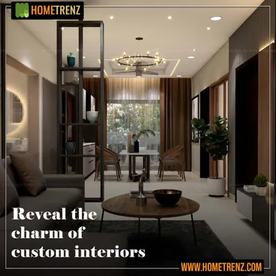 I design custom interiors that are a true reflection of you. This living area features a dark metal partition for subtle separation, a comfortable sofa, and a modern chandelier, all coming together to create a charming and personalized space.