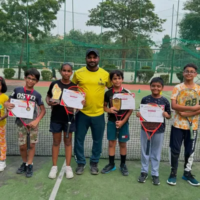 A proud moment with our young achievers from the DDA Tennis Tournament 2024. This group photo showcases the breadth of talent at our academy, with multiple players winning certificates, medals, and trophies.