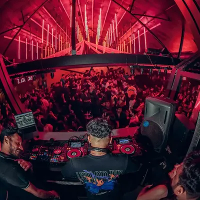 A fish-eye view from my console during a packed night. This perspective shows the scale of the events I play and the immersive, high-energy atmosphere I command.