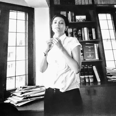 A black and white portrait from around 2010, taken by Olivia Arthur of Magnum Photos for the "Women Changing India" book. This captures a moment at the end of a long day in court.