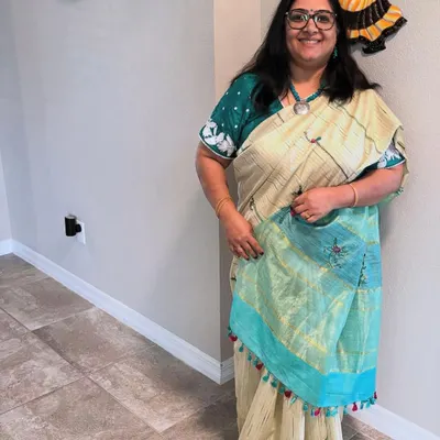 A client looking beautiful in a saree I embroidered for her. It is always a pleasure to receive photos and see my creations become part of someone's special day.