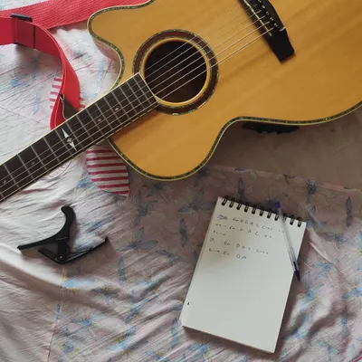 It all begins with your story. I take the details you give me and start mapping out the song's structure, chords, and lyrics in my notebook. This is the blueprint for your custom piece.