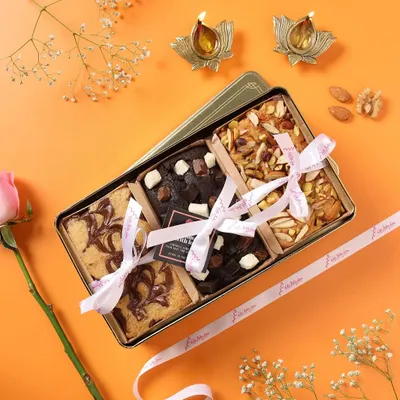 Introducing my luxury tin boxes for gifting. This one is filled with an assortment of my most popular brownies, tied with a beautiful ribbon.