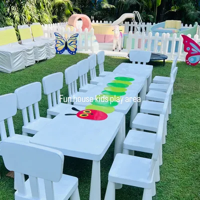 Our white kid-sized tables and chairs are perfect for party activities, crafts, or a meal. Here they are set up for a "Very Hungry Caterpillar" themed party.