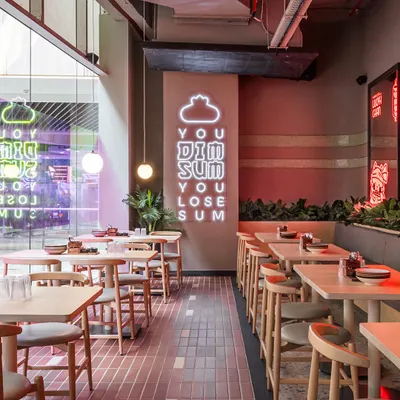 The playful neon sign at Lucky Chan is a perfect example of how we use light to inject personality and brand voice directly into the decor. It's a fun, memorable, and highly photographic moment.