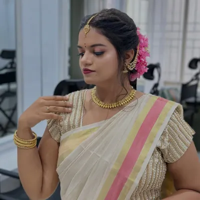 A stunning South Indian bridal makeup look created by one of our students. The focus is on flawless skin, defined eyes, and traditional accessories.