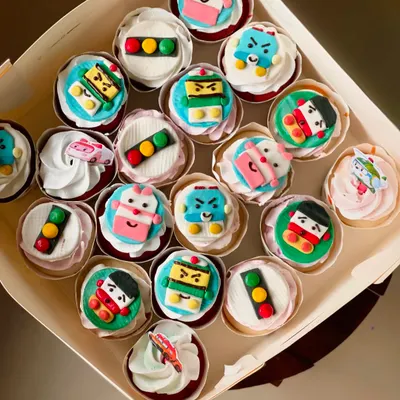 A full box of my Robocar Poli themed cupcakes. Each character is carefully crafted from fondant, and I've also included some fun traffic light toppers.