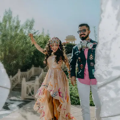 It's Rhea's world, and we're just vibing in it. For this festival-themed luncheon, the couple's outfits were as bold and unique as the decor, featuring avant-garde accessories and vibrant installations.