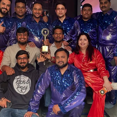Celebrating a win with the performers at a corporate awards show. I provide complete event solutions, including costumed dancers that match the theme of your company's celebration.