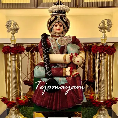 A beautifully decorated doll representing the goddess Lakshmi, ready for a housewarming ceremony. Every corner of a new home should begin with a blessing.