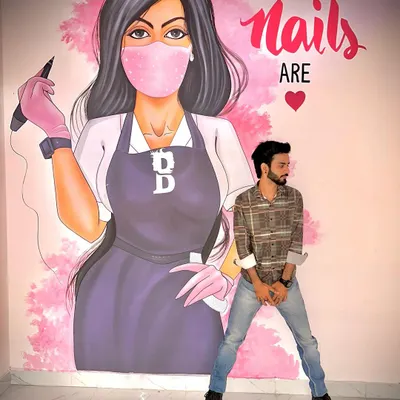 Here I am in my element, at my studio. I believe that the space you're in should be as inspiring as the art itself. This mural is a daily reminder that while we may not be perfect, our nails, brows, and lips can be.