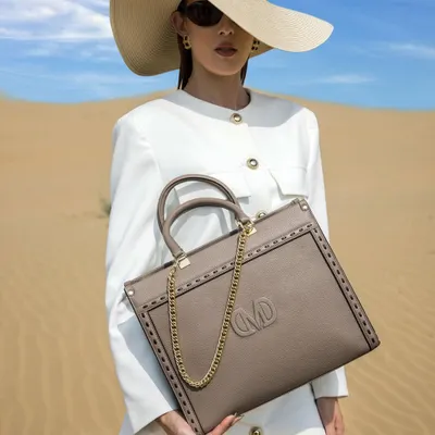 This is from a campaign I styled and creatively directed for Italian handbag brand Damilano. Shot in the Jaisalmer dunes, the look pairs a chic white coat dress and a wide-brimmed hat to create a sophisticated, high-end commercial image that puts the luxury bag front and center.
